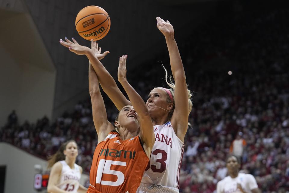 Miami's Hanna Cavinder (15) shoots against Indiana's Sydney Parrish (33) during the second half of a second-round college basketball game in the women's NCAA Tournament Monday, March 20, 2023, in Bloomington, Ind. (AP Photo/Darron Cummings)