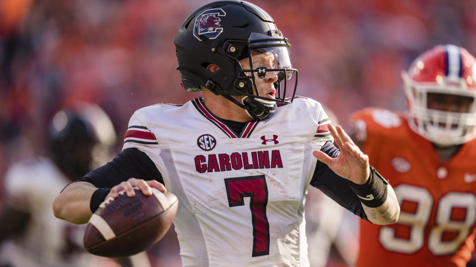 South Carolina quarterback Spencer Rattler (7) plays against Clemson during an NCAA college football game on Saturday, Nov. 26, 2022, in Clemson, S.C. (AP Photo/Jacob Kupferman)