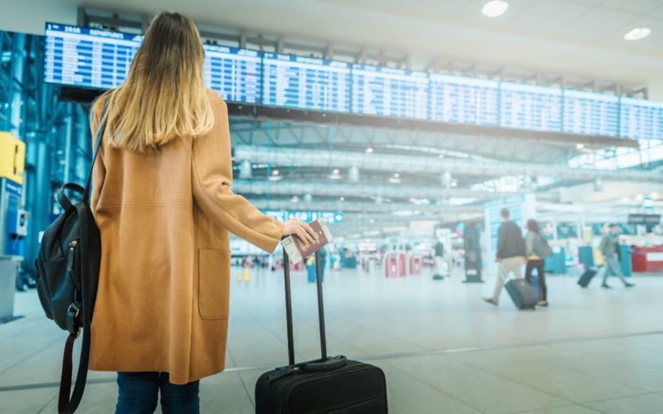 A business traveler about to catch a flight.  Pxfuel