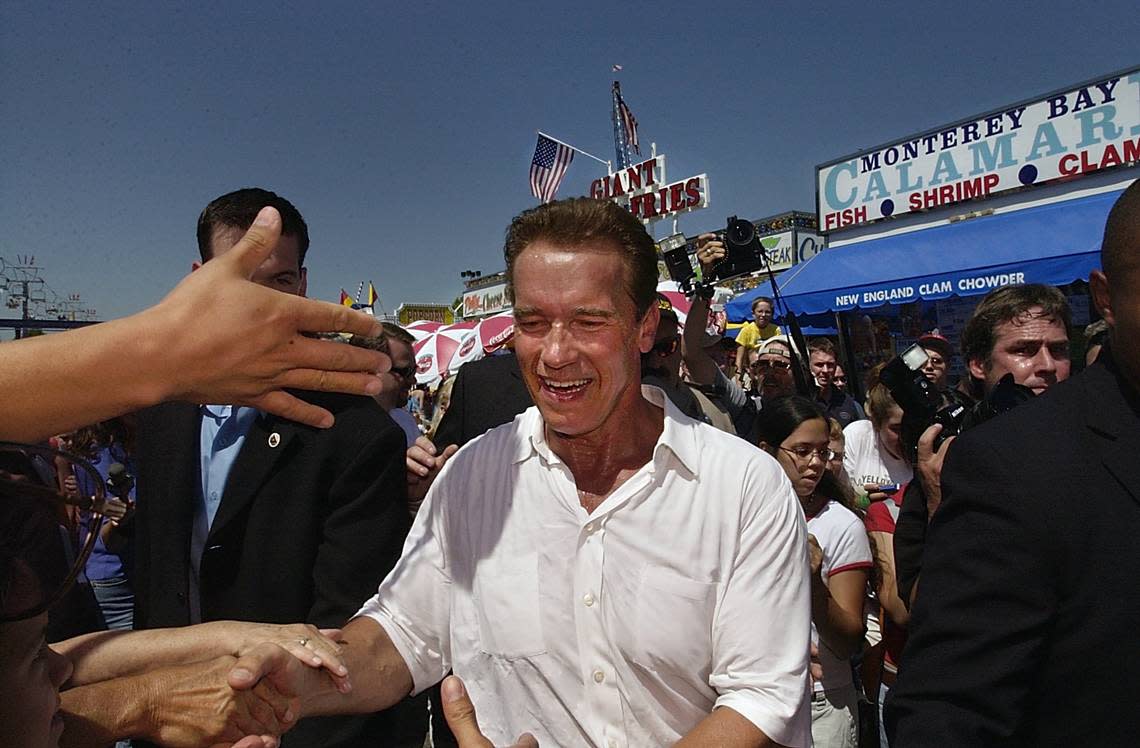 Actor and California gubernatorial candidate Arnold Schwarzenegger greets fans and supporters at the California State Fair on Sept. 1, 2003. MANNY CRISOSTOMO/Sacramento Bee file