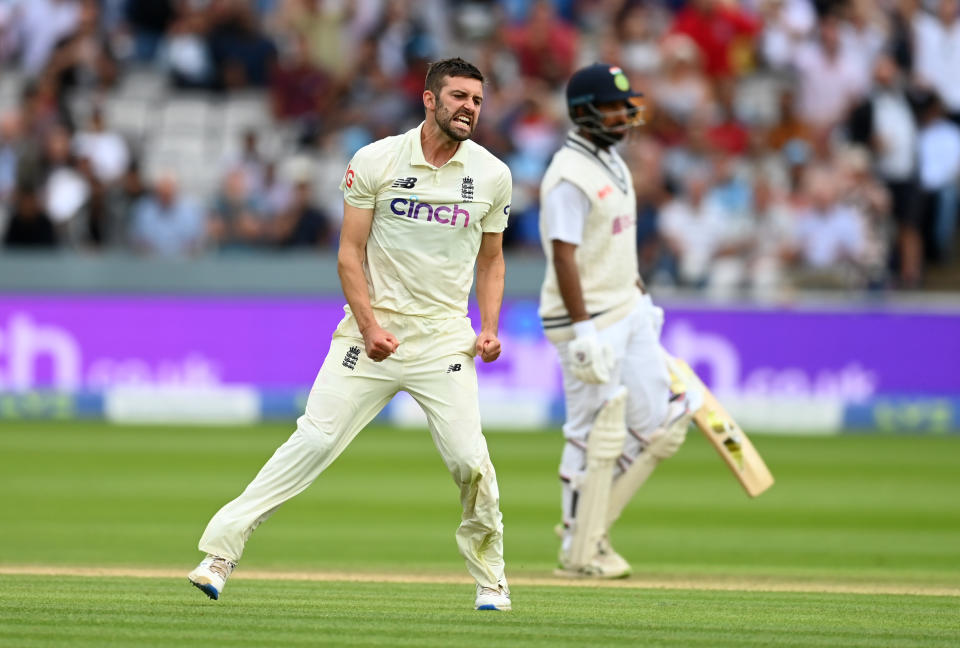 LONDON, ENGLAND - AUGUST 15: Mark Wood of England celebrates dismissing Cheteshwar Pujara of India during day four of the Second LV= Insurance Test Match between England and India at Lord's Cricket Ground on August 15, 2021 in London, England. (Photo by Gareth Copley/Getty Images)