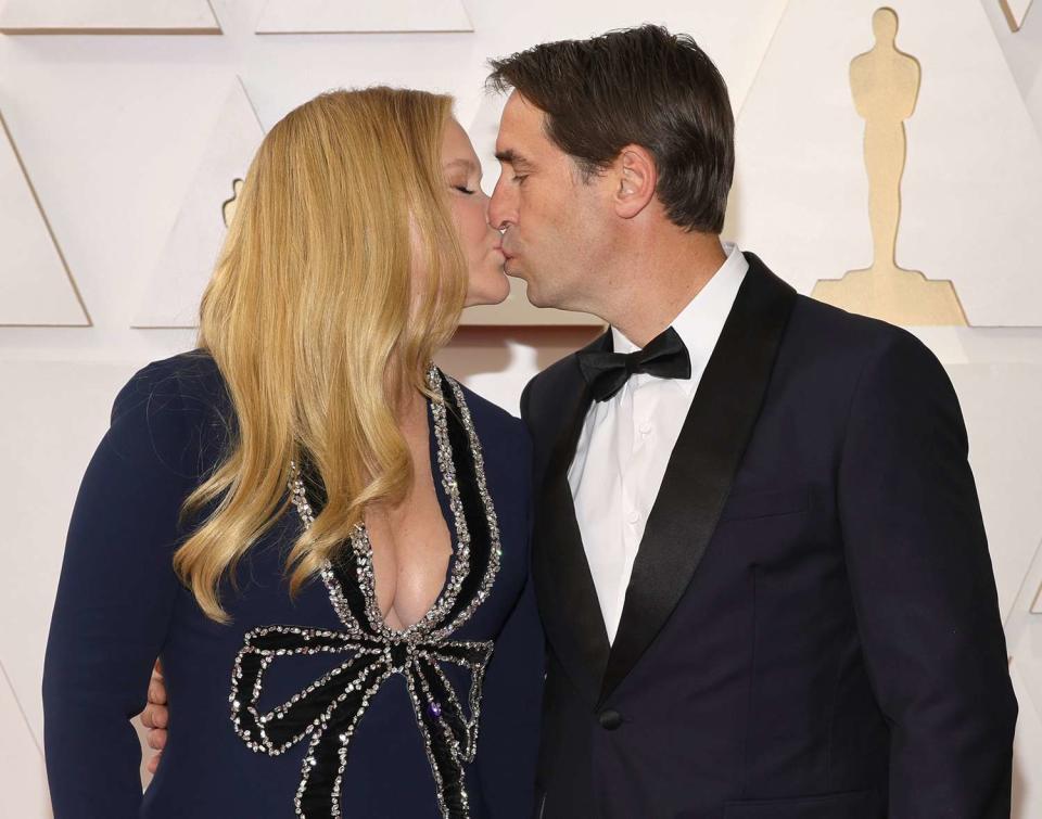 Amy Schumer and Chris Fischer attend the 94th Annual Academy Awards at Hollywood and Highland on March 27, 2022 in Hollywood, California