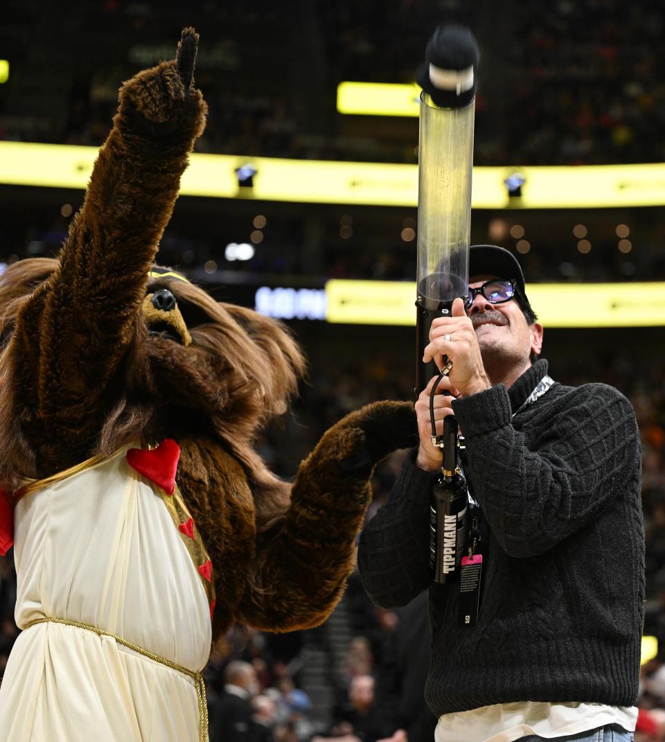 Ty Burrell from the TV series Modern Family shoots a teeshirt into the stands with the help of the <a class="link " href="https://sports.yahoo.com/nba/teams/utah/" data-i13n="sec:content-canvas;subsec:anchor_text;elm:context_link" data-ylk="slk:Jazz;sec:content-canvas;subsec:anchor_text;elm:context_link;itc:0">Jazz</a> Bear as the Utah Jazz and the Los Angeles Lakers play at the Delta Center in Salt Lake City on 2/14/24. LA won 138-122. | Scott G Winterton, Deseret News