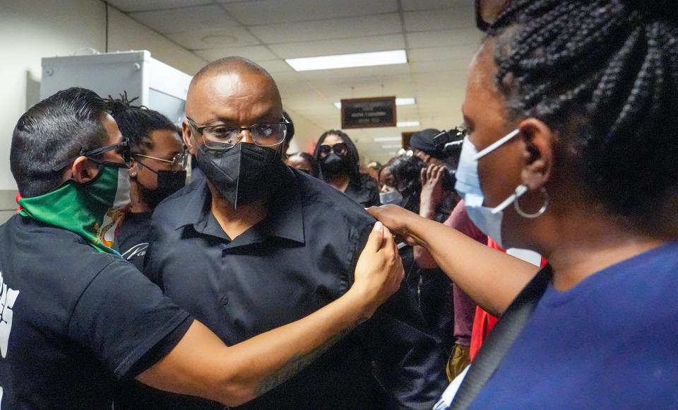 Jay Anderson Sr., is consoled by supporters following the hearing held by Judge Glenn Yamahiro Wednesday, June 1, 2022, where two special prosecutors announced they would not charge former Wauwatosa police officer Joseph Mensah for the shooting of Jay Anderson Jr.