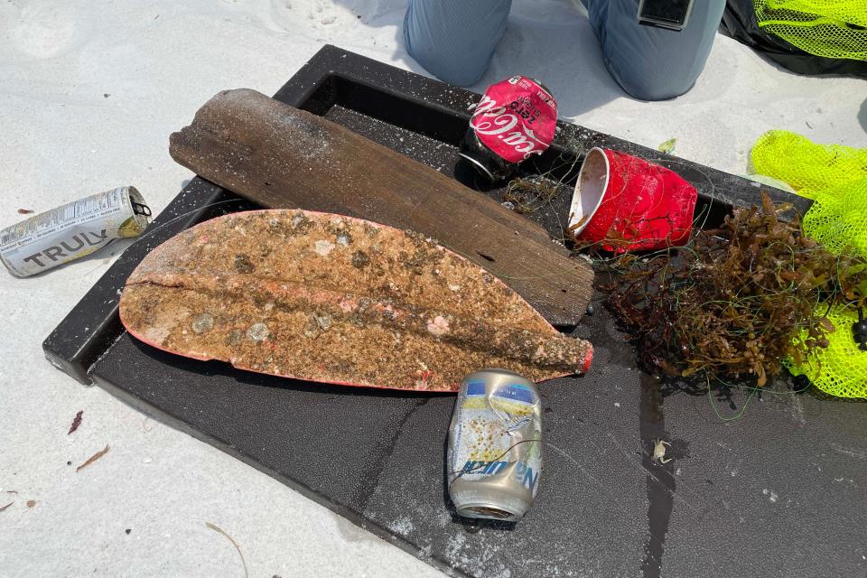 Scuba divers found a variety of trash during an organized cleanup around Destin's East Pass last year. Saltwater Restaurants and the Destin-Fort Walton Beach Tourist Development Department will host beach cleanups Saturday at six locations along the coast, from Okaloosa Island east to Miramar Beach.
