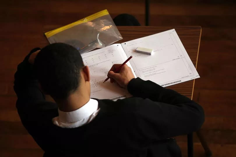 A pupil sitting a maths exam