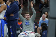 Dallas Mavericks guard Luka Doncic celebrates on the bench during the second half of Game 7 of an NBA basketball Western Conference playoff semifinal against the Phoenix Suns, Sunday, May 15, 2022, in Phoenix. The Mavericks defeated the Suns 123-90. (AP Photo/Matt York)