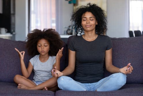 <span class="caption">Meditation might be one way of calming anxious thoughts.</span> <span class="attribution"><a class="link " href="https://www.shutterstock.com/image-photo/mindful-african-mom-cute-funny-kid-1289448838" rel="nofollow noopener" target="_blank" data-ylk="slk:fizkes/ Shutterstock;elm:context_link;itc:0;sec:content-canvas">fizkes/ Shutterstock</a></span>