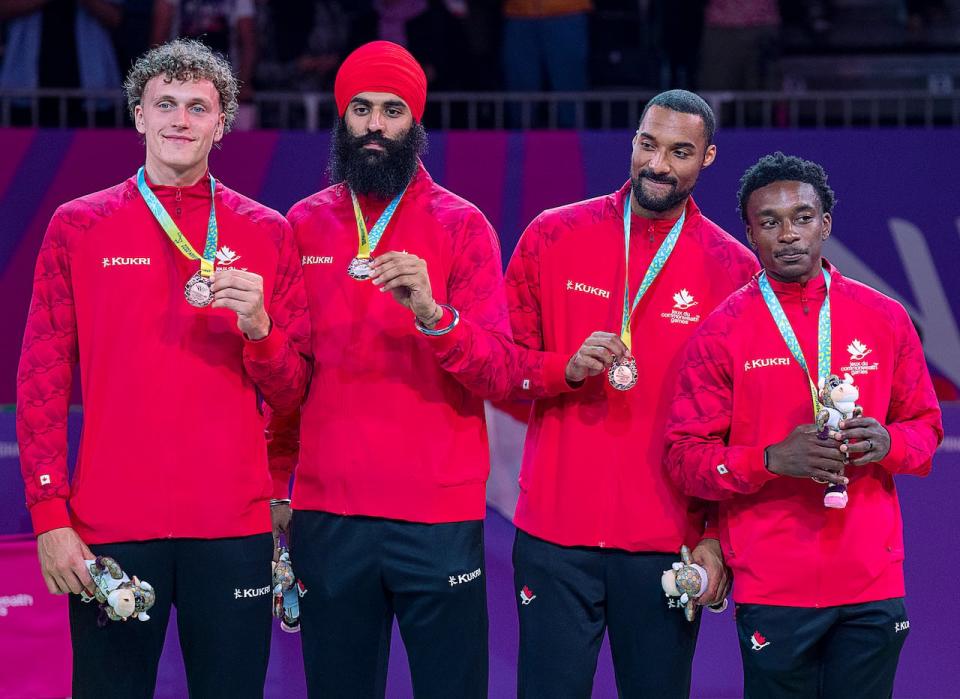 Canada's Adam Paige, Biramjit Gill, Jordan Jensen-Whyte and Alex Johnson, left to right, display their bronze medals in men's 3x3 basketball at the Commonwealth Games in Birmingham, England.