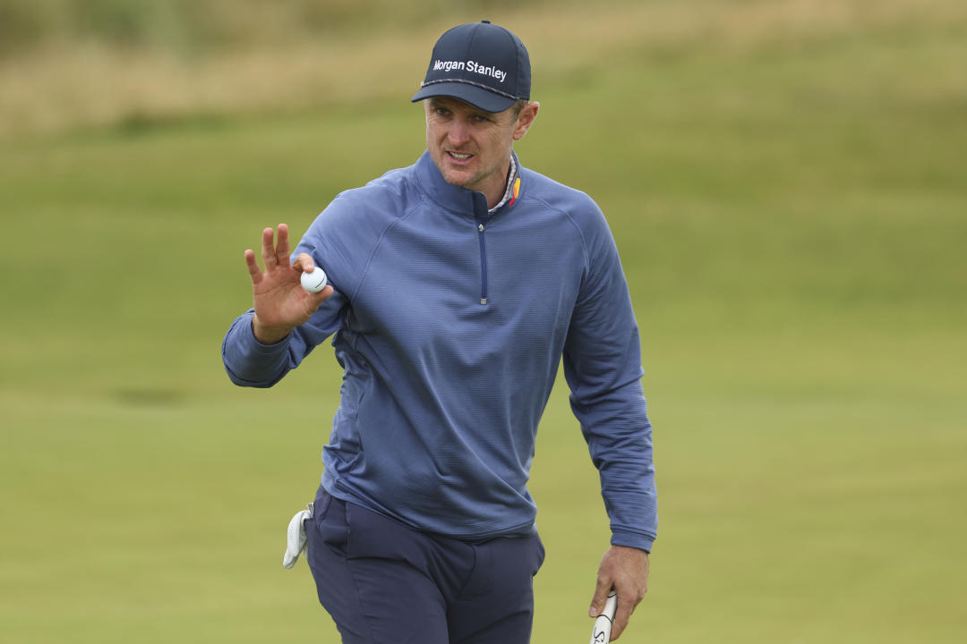 Justin Rose of England gestures after a putt on the fifth green during his second round of the British Open Golf Championships at Royal Troon golf club in Troon, Scotland, Friday, July 19, 2024. (AP Photo/Peter Morrison)