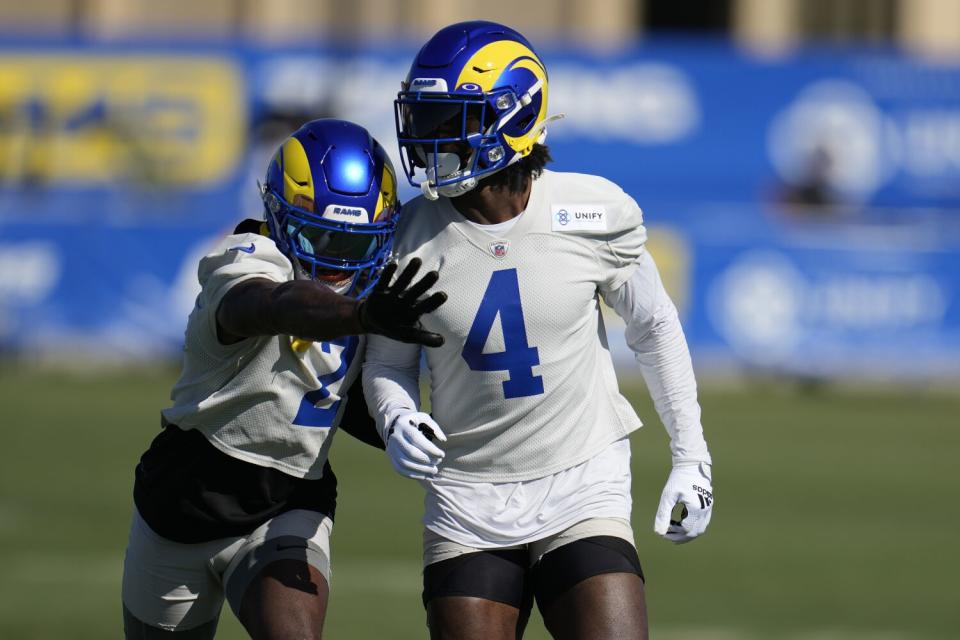 Rams safeties Russ Yeast (2) and Jordan Fuller run a drill.