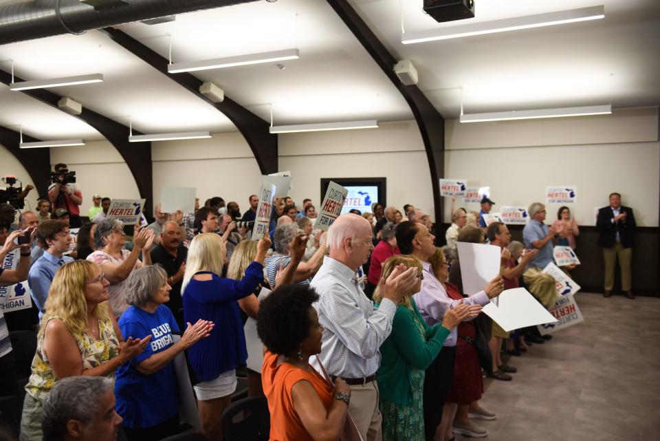 People applaud Monday, June 10, 2023, as Curtis Hertel Jr. officially announced his run for congress at the United Association Local 333 building in Lansing.