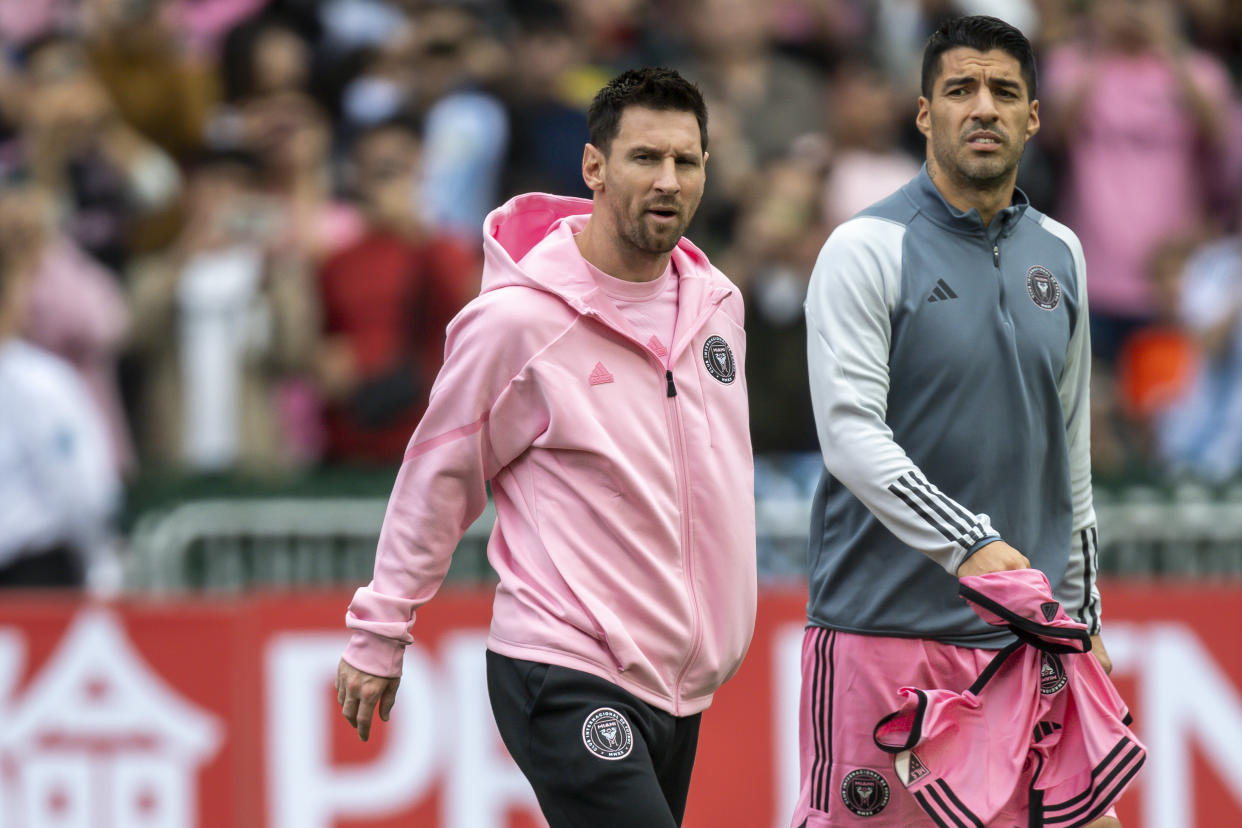 Fans in Hong Kong weren't interested in seeing Lionel Messi, left, and Luis Suárez in street clothes. (Stephen Law/Eurasia Sport Images/Getty Images)
