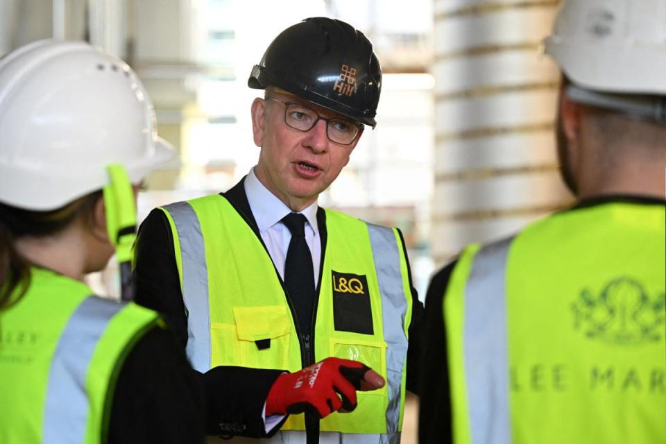 Journalists sat around a conference table in a plain white room while Gove toured the site (Reuters)