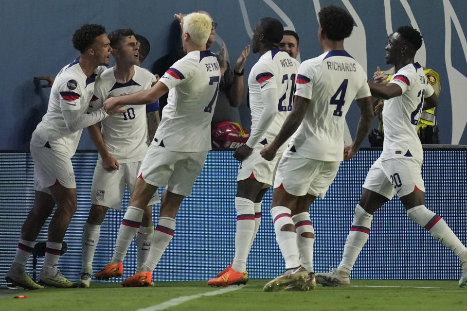 Christian Pulisic of the United States, second from left, celebrates after scoring against Mexico during the first half of a CONCACAF Nations League semifinal soccer match Thursday, June 15, 2023, in Las Vegas. (AP Photo/John Locher)