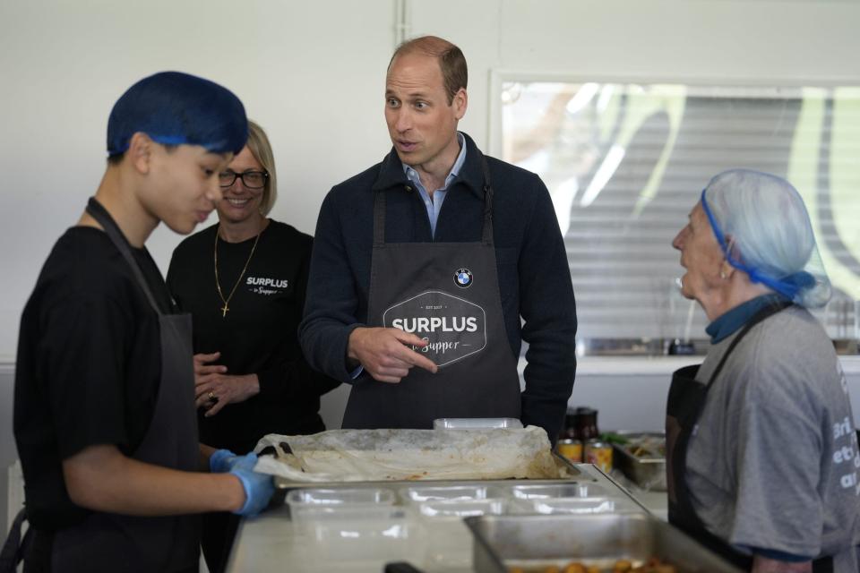 Prince William mingling with volunteers.