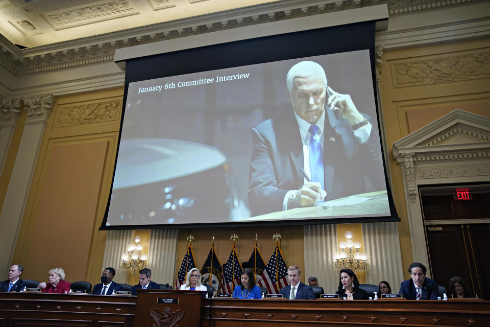 An image of then-Vice President Pence talking on the phone is displayed on a screen.