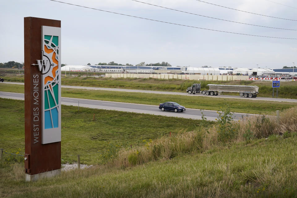 FILE - Traffic on Interstate 35 passes a Microsoft data center on Sept. 5, 2023, in West Des Moines, Iowa. Artificial intelligence systems like ChatGPT could soon run out of what keeps making them smarter — the tens of trillions of words that people have written and shared online. (AP Photo/Charlie Neibergall, File)