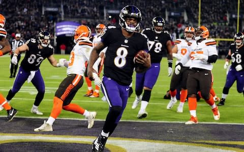 Baltimore Ravens quarterback Lamar Jackson (8) scores a touchdown in the second quarter against the Cleveland Browns at M&T Bank Stadium - Credit: USA TODAY