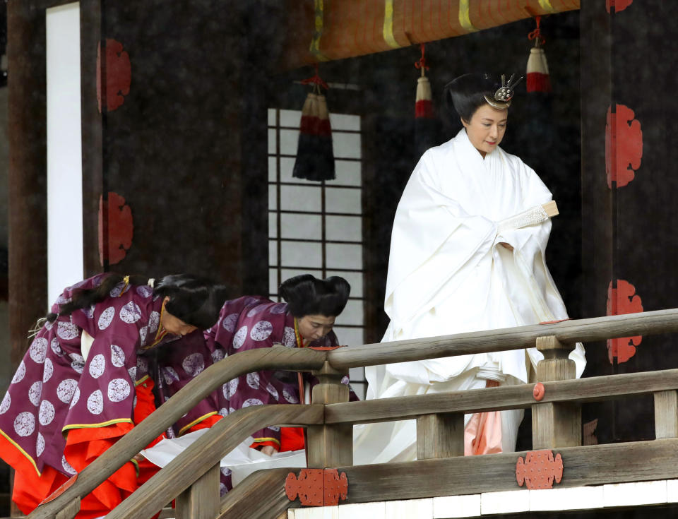 Japan's Empress Masako leaves after praying at “Kashikodokoro”, one of three shrines at the Imperial Palace, in Tokyo, Tuesday, Oct. 22, 2019. Emperor Naruhito and Empress Masako visited three Shinto shrines at the Imperial Palace before Naruhito proclaims himself Japan’s 126th emperor in an enthronement ceremony. (Kyodo News via AP)