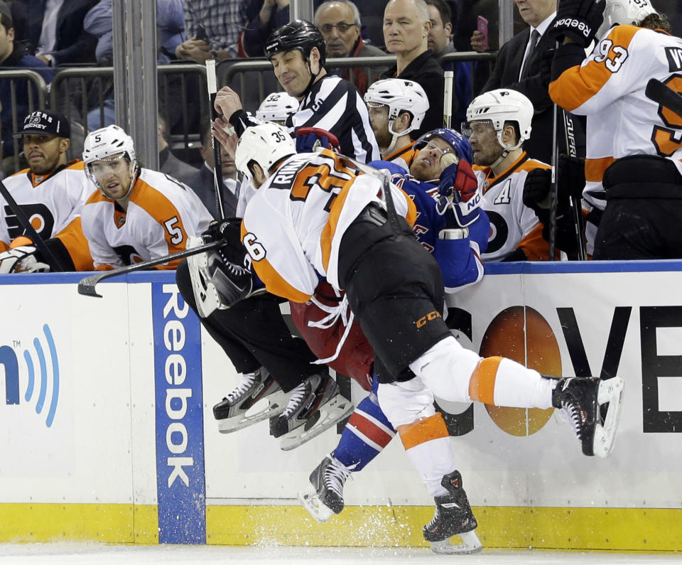 Philadelphia Flyers' Zac Rinaldo (36) checks New York Rangers' Brad Richards (19) during the first period in Game 7 of an NHL hockey first-round playoff series on Wednesday, April 30, 2014, in New York. (AP Photo)