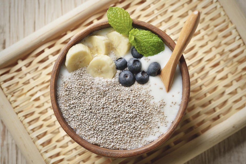 Raw chia seed, banana, blueberry and mint are topping to yogurt,Super food