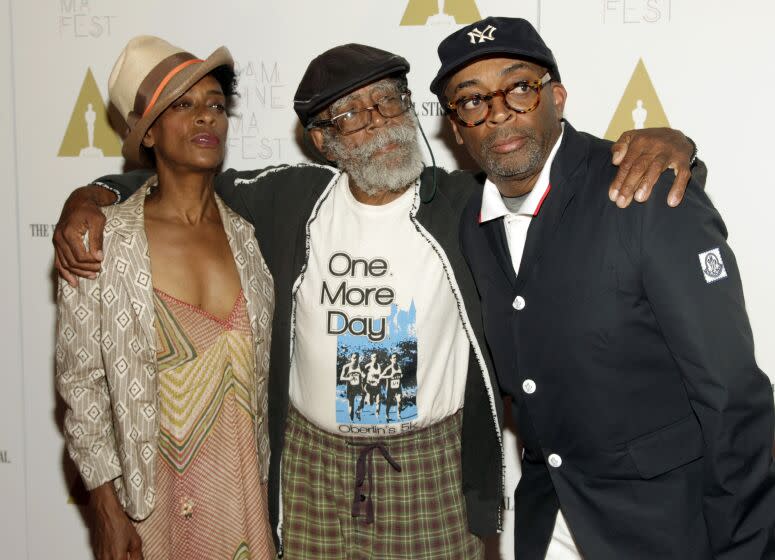 FILE - Director Spike Lee, right, and his with sister, screenwriter Joie Lee, left, appear with their father Bill Lee at a screening of "Do The Right Thing" in New York on June 29, 2014. Bill Lee, a well-regarded jazz musician who accompanied such artists as Bob Dylan, Simon and Garfunkel and Harry Belafonte as well as scoring four of his son Spike's early films, died Wednesday, May 24, 2023, according to Theo Dumont, a publicist for Spike Lee. He was 94. (Photo by Andy Kropa/Invision/AP, File)