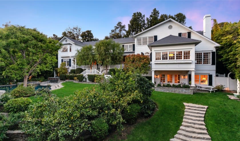 Built in 1999, the East Coast-inspired traditional sits on half an acre in gated Hidden Valley.