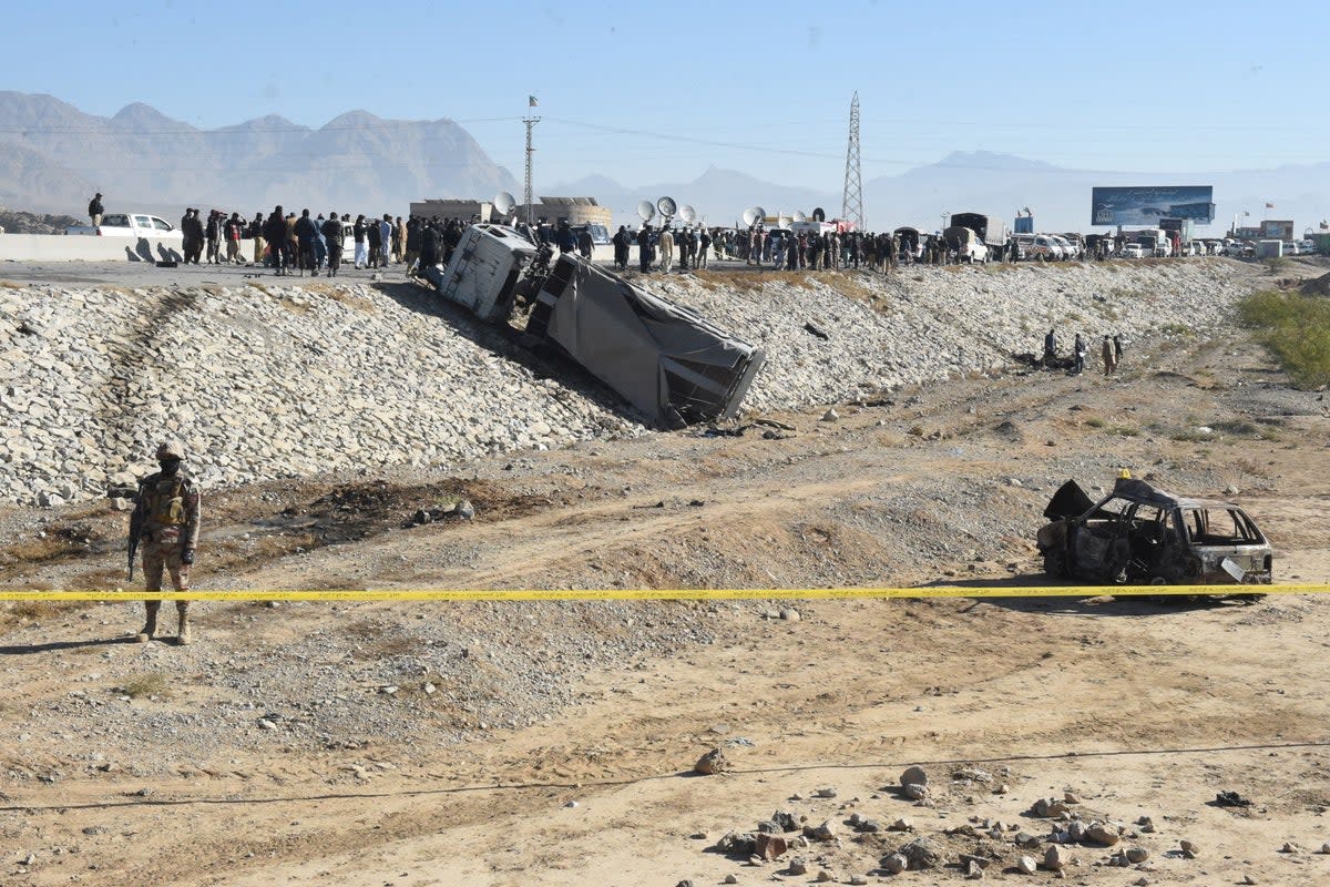 A security official stands guard at the site of a suicide bomb attack targeting a police truck in Quetta on 30 November 2022 (AFP via Getty Images)