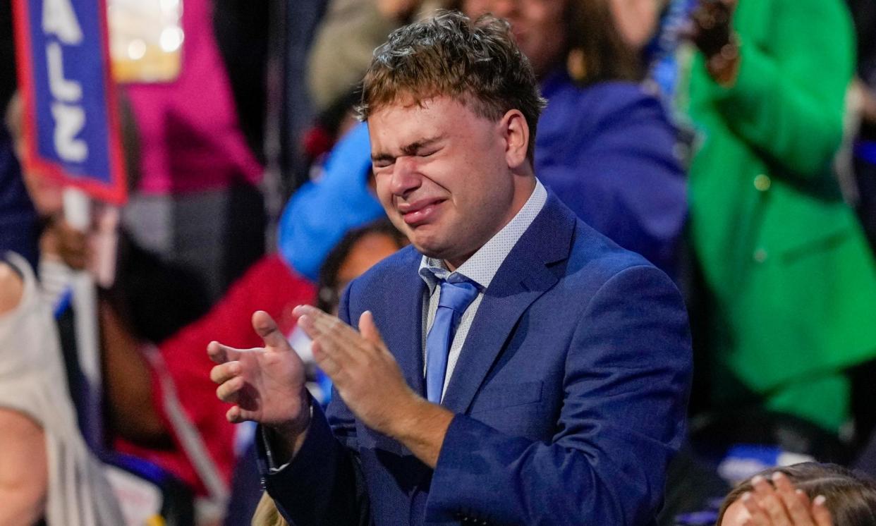 <span>Gus Walz burst into tears during his father Tim Walz’s speech at the Democratic national convention on Wednesday evening.</span><span>Photograph: Matt Rourke/AP</span>