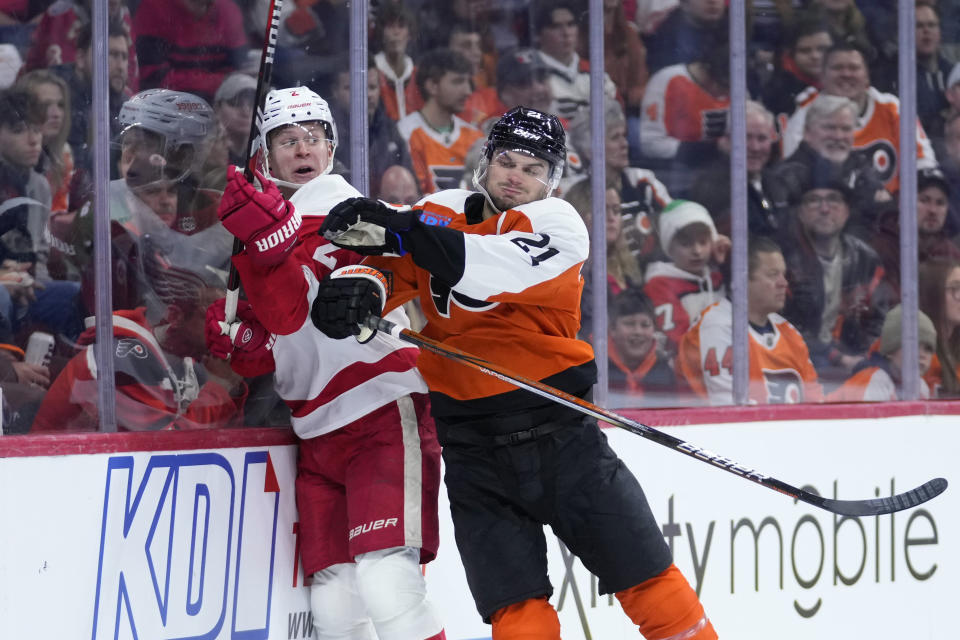 Philadelphia Flyers' Scott Laughton, right, collides with Detroit Red Wings' Olli Maatta during the second period of an NHL hockey game, Saturday, Dec. 16, 2023, in Philadelphia. (AP Photo/Matt Slocum)