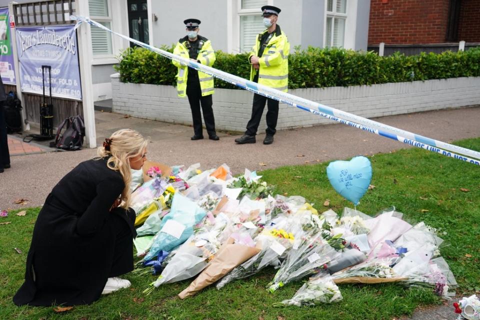 People leave flowers at the scene near Belfairs Methodist Church (Dominic Lipinski/PA) (PA Wire)