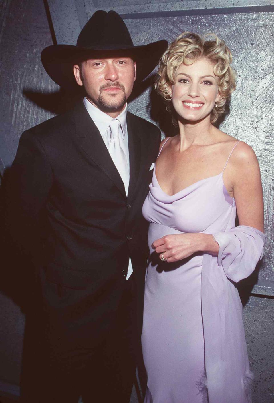 Tim McGraw and his wife, Faith Hill backstage at the 41st Annual Grammy Awards.