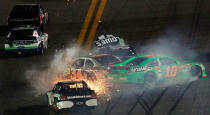 DAYTONA BEACH, FL - FEBRUARY 27: Danica Patrick, driver of the #10 GoDaddy.com Chevrolet, David Ragan, driver of the #34 Front Row Motorsports Ford, and Jimmie Johnson, driver of the #48 Lowe's Chevrolet, spin after an on track incident in the NASCAR Sprint Cup Series Daytona 500 at Daytona International Speedway on February 27, 2012 in Daytona Beach, Florida. (Photo by Tom Pennington/Getty Images for NASCAR)