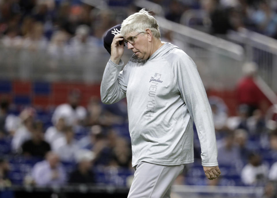 New York Yankees pitching coach Larry Rothschild walks from the mound during the eleventh inning of a baseball game against the Miami Marlins, Tuesday, Aug. 21, 2018, in Miami. The Yankees won 2-1 in twelve innings. (AP Photo/Lynne Sladky)