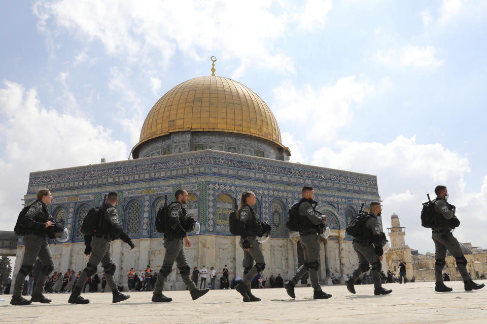 Israeli police maneuver through the Al Aqsa Mosque compound after Friday prayers to clear a protest a protest celebrating the six Palestinian prisoners who tunneled out of Gilboa Prison, in the Old City of Jerusalem, Friday, Sept. 10, 2021. (AP Photo/Mahmoud Illean)