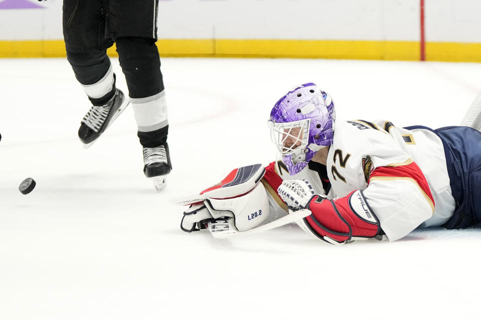 Florida Panthers goaltender Sergei Bobrovsky lays on the ice after Los Angeles Kings center Anze Kopitar scored on him during the second period of an NHL hockey game Thursday, Nov. 16, 2023, in Los Angeles. (AP Photo/Mark J. Terrill)