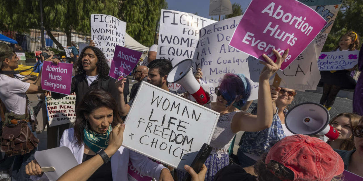 People argue as a group of anti-abortion protesters crashes the Women’s March Action Rally for Reproductive Rights at Mariachi Plaza in Los Angeles, California, on October 8, 2022.
DAVID MCNEW / AFP