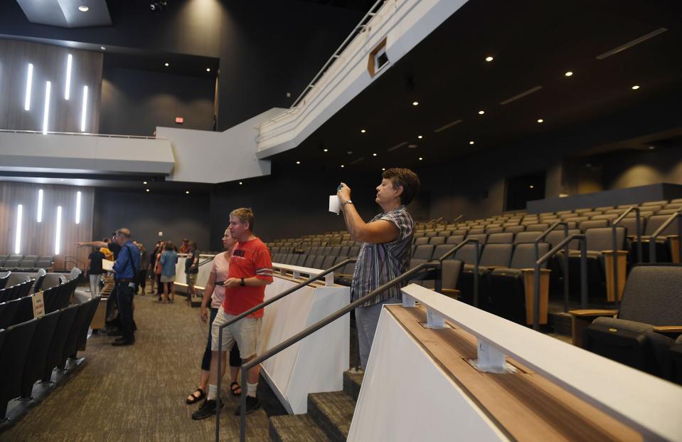 Visitors tour the auditorium of the new Ames High School building during an open house  Aug. 2, 2022. The performance arts center was named for Wayne “Hank” Hansen during a ceremony Aug. 12, 2023.