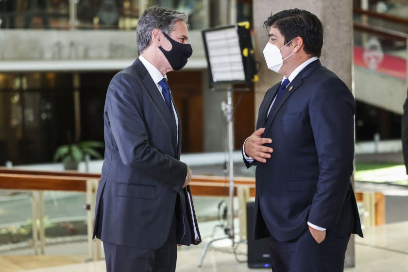 U.S. Secretary of State Antony Blinken and Costa Rica's President Carlos Alvarado Quesada talk before a news conference Tuesday, June 1, 2021, in San Jose, Costa Rica. (Evelyn Hockstein/Pool via AP)