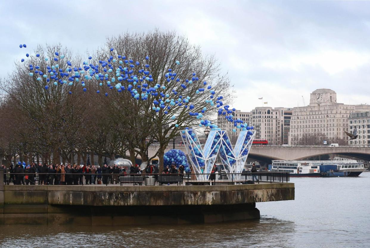 A balloon release in London: PA