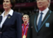 Gold medallist Canada's Rosannagh Maclennan sings the national anthem during the podium ceremony of the women's trampoline at the 2012 Summer Olympics, Saturday, Aug. 4, 2012, in London. (AP Photo/Gregory Bull)