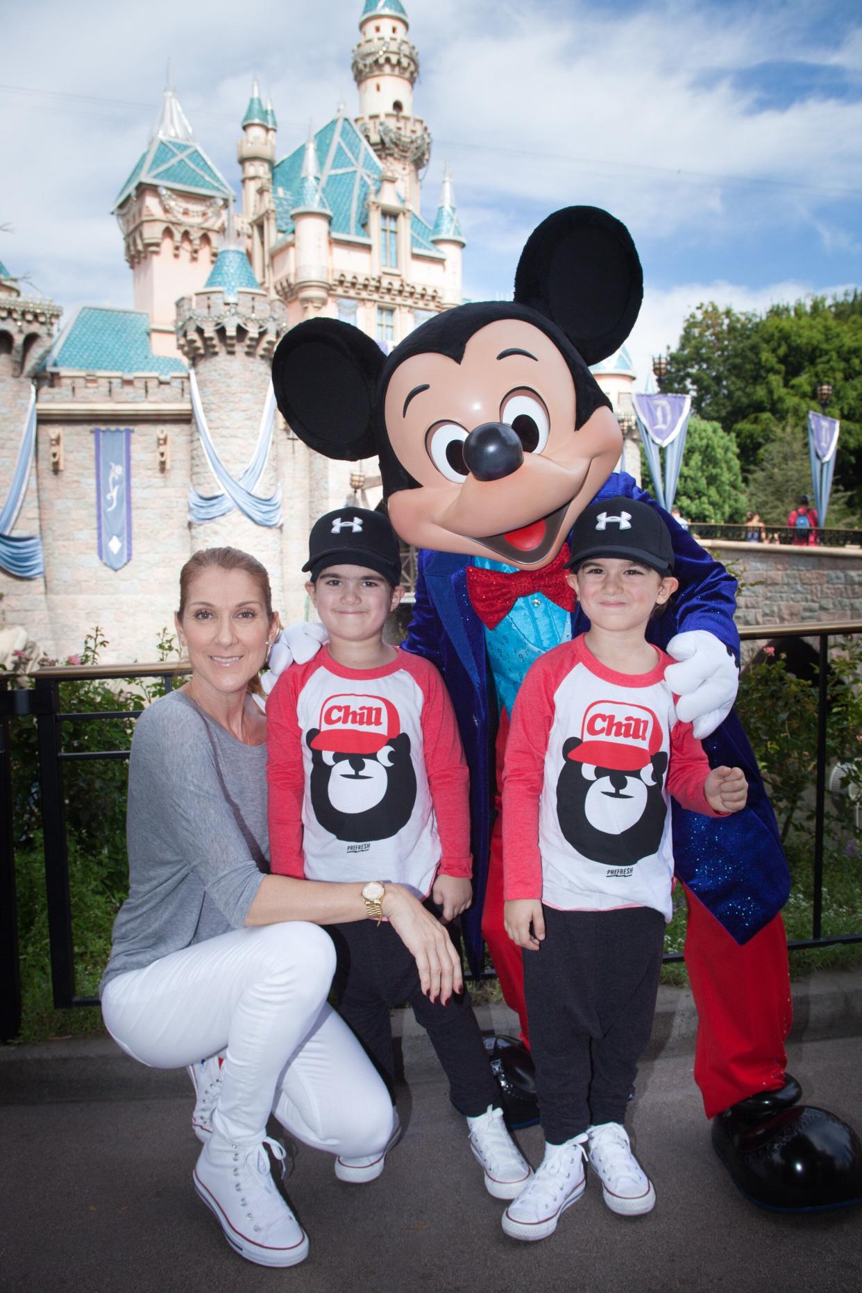 Celine Dion and twin sons Eddy and Nelson celebrate the boys' fifth birthday with Mickey Mouse at Disneyland in Anaheim, California, in October 2015. (Photo: Handout via Getty Images)