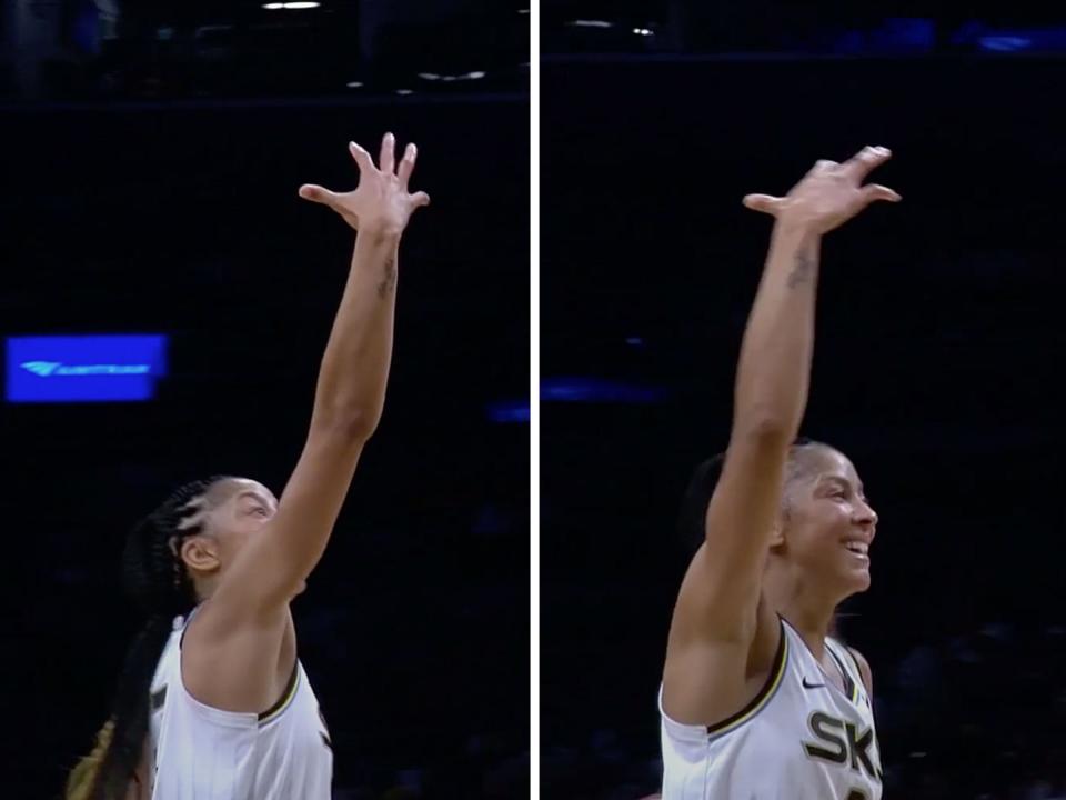 Candace Parker looks at her hand after scoring a miraculous basket.