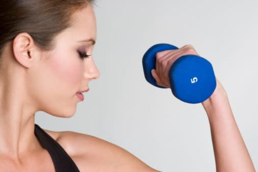 woman exercising with weights