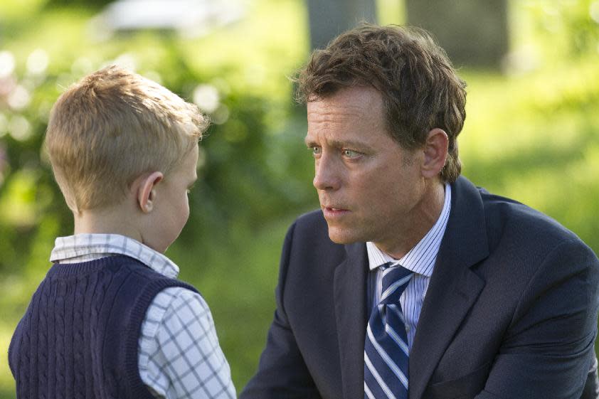 This image released by Sony Pictures shows Connor Corum, left, and Greg Kinnear in a scene from "Heaven Is For Real." (AP Photo/Sony Pictures, Allen Fraser)