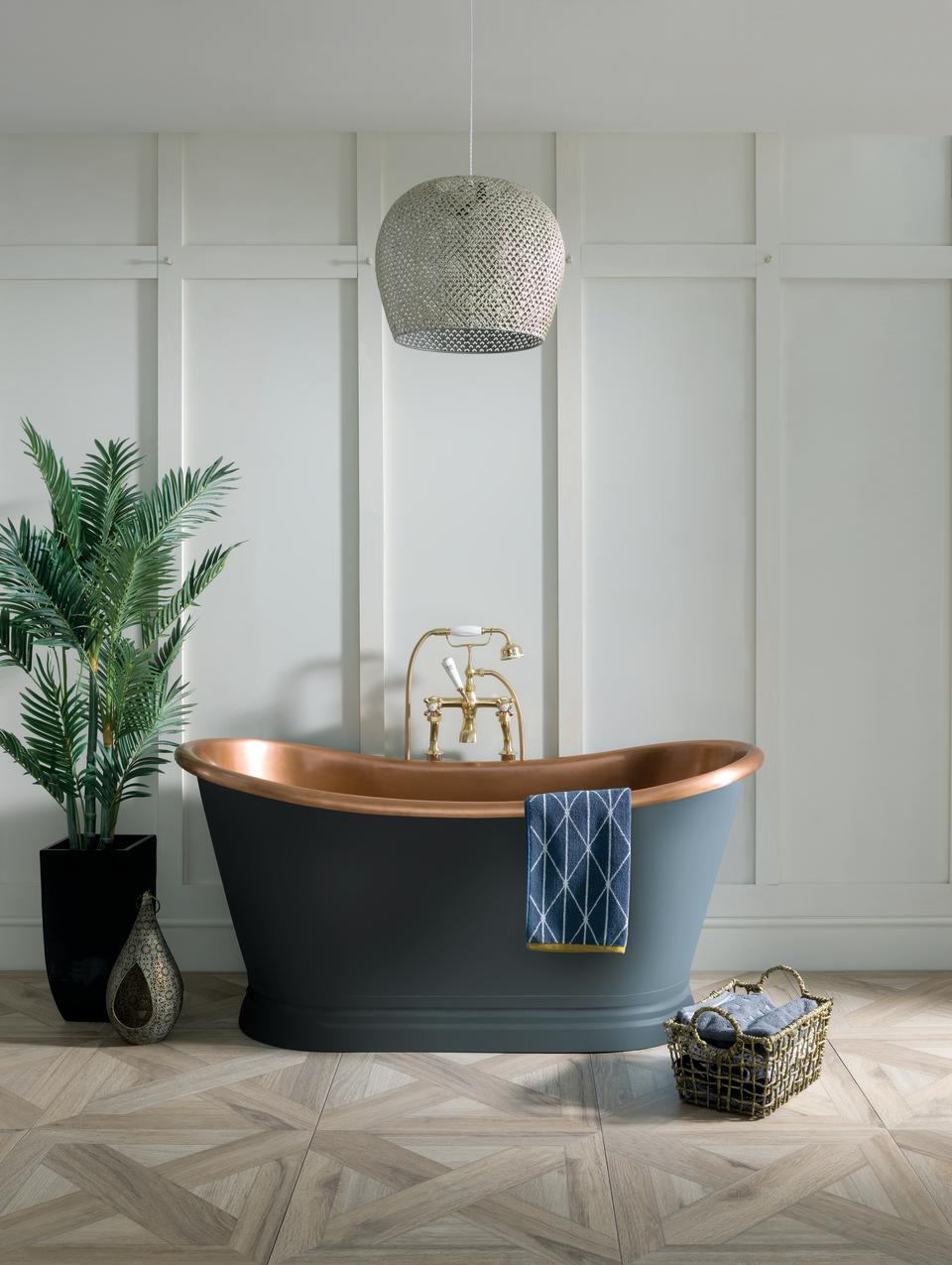 copper bath with blue painted exterior