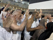 Muslim pilgrims circumambulate around the Kaaba, the cubic building at the Grand Mosque in the Saudi Arabia's holy city of Mecca, Tuesday, July 5, 2022. Saudi Arabia is expected to receive one million Muslims to attend Hajj pilgrimage, which will begin on July 7, after two years of limiting the numbers because coronavirus pandemic. (AP Photo/Amr Nabil)