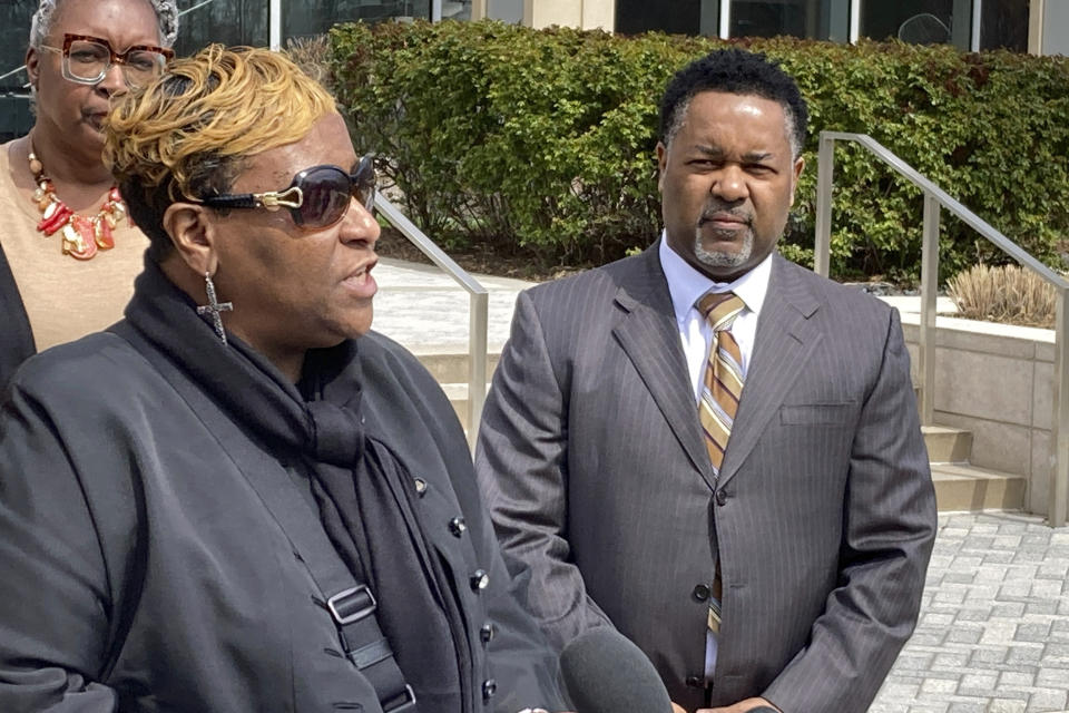 Timothy McCree Johnson's mother Melissa Johnson, along with attorney Carl Crews, addresses reporters outside Fairfax County Police headquarters, Wednesday, March 22, 2023, in Fairfax, Va., after viewing police body camera video of their son's shooting death at the hands of police last month outside Tysons Corner Center shopping mall. (AP Photo/Matthew Barakat)