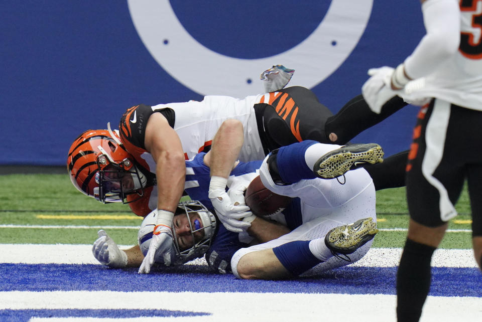 Indianapolis Colts' Jack Doyle, bottom, makes a touchdown reception against Cincinnati Bengals' Logan Wilson, top, during the second half of an NFL football game, Sunday, Oct. 18, 2020, in Indianapolis. (AP Photo/AJ Mast)